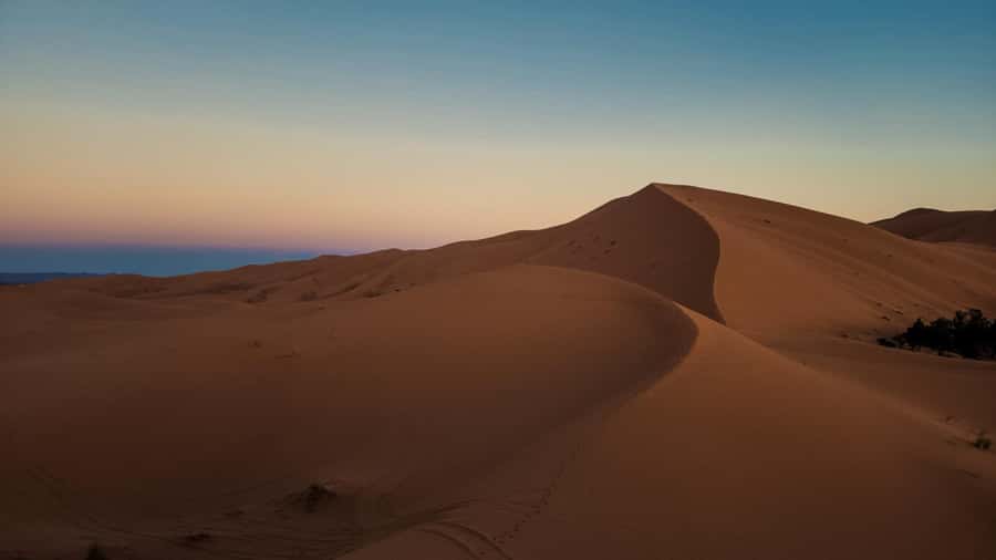 3-Day luxury Adventure: Marrakech to Merzouga incl.Quad/show - Erg Chebbi at sunset: camels, sand, and camp life