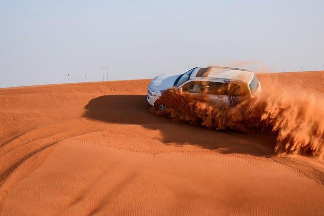 6-Hour Dubai Desert Safari with BBQ Dinner & Quad Biking - Dune bashing with drivers who set the tone