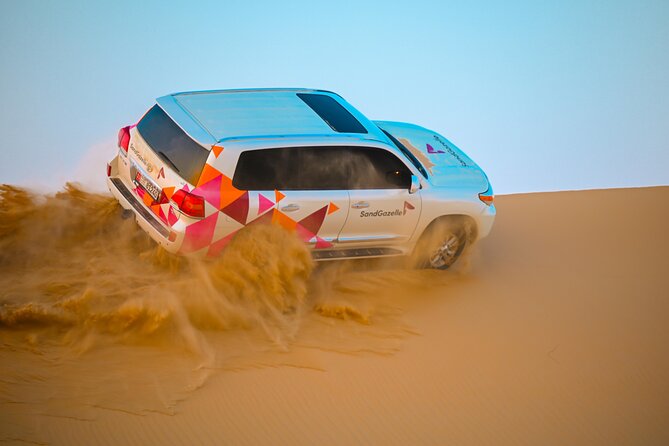 Abu Dhabi Evening Desert Safari - Private car Dune bashing & BBQ - Fire, Tanoura, and belly dance shows