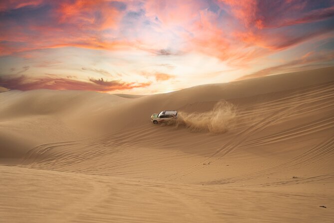Abu Dhabi Morning Desert Safari: 4x4 Dune Bashing, Camel Ride and Sandboarding - Sandboarding on the dunes
