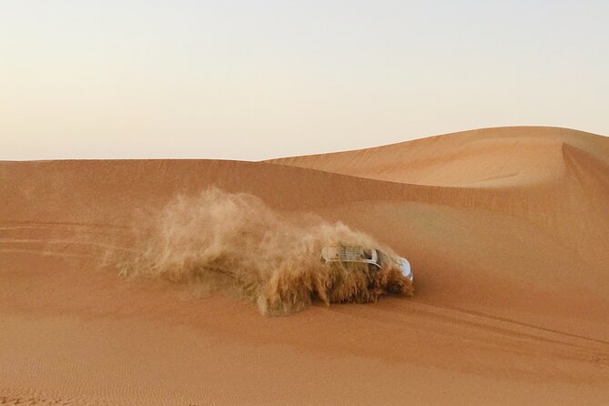 Abu Dhabi Morning Desert Safari,Dune Bashing,Sandboarding,Camel Riding&Quad Bike - Dune bashing on Abu Dhabi’s high dunes