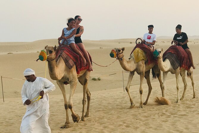 Abu Dhabi Morning Desert Safari,Dune Bashing,Sandboarding,Camel Riding&Quad Bike - Camel riding at the desert camp