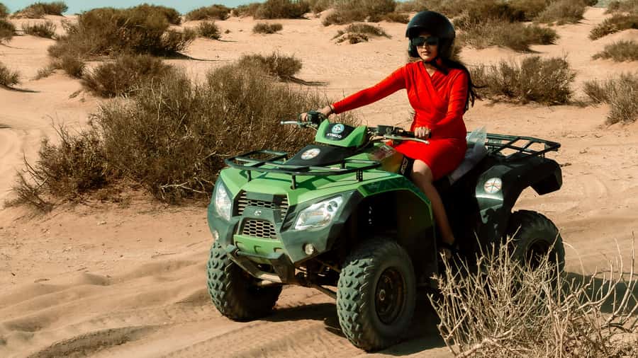 Agadir: Quad Biking Ride Desert Adventure - Rocky foothills, argan trees, and dry riverbeds