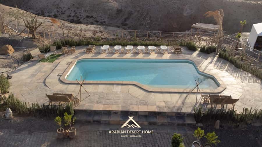 Agafay Desert: Quad, Camel Ride & Luxury Lunch with Pool - A desert pool and sunset rest