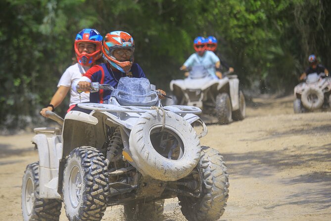 ATV adventure, Ziplines, Cenote Swim, Snack & Transport Included. - ATV riding through the jungle