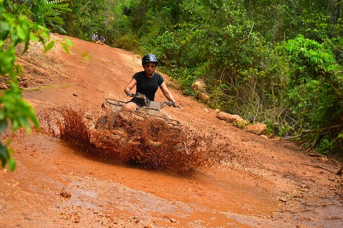 ATV Combo Horseback Riding, ATV, Ziplines, Cenote and Lunch - ATV riding on a rough jungle course
