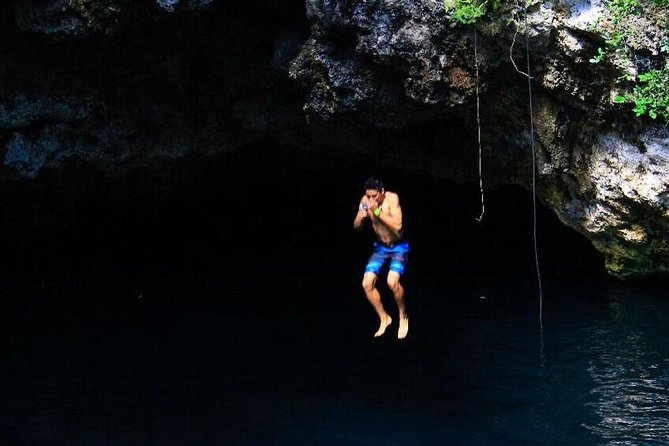 ATV Tour with Cenote swim, Ziplines, Transportation and Lunch Included - ATV riding on a rough jungle track
