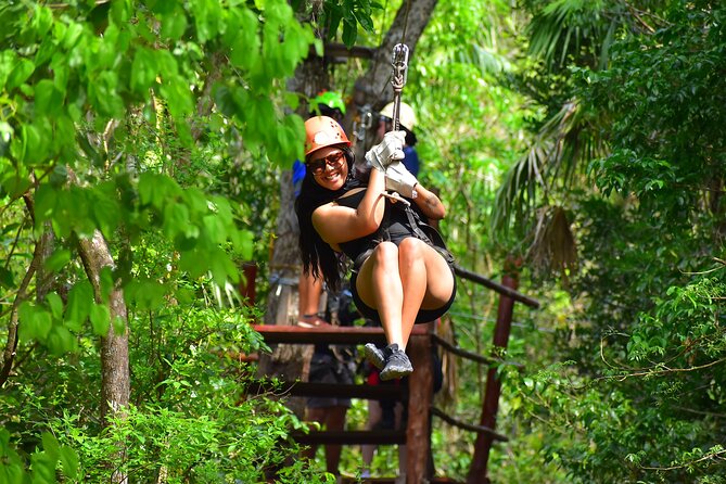 ATV Tour with Cenote swim, Ziplines, Transportation and Lunch Included - Zip lines above the trees