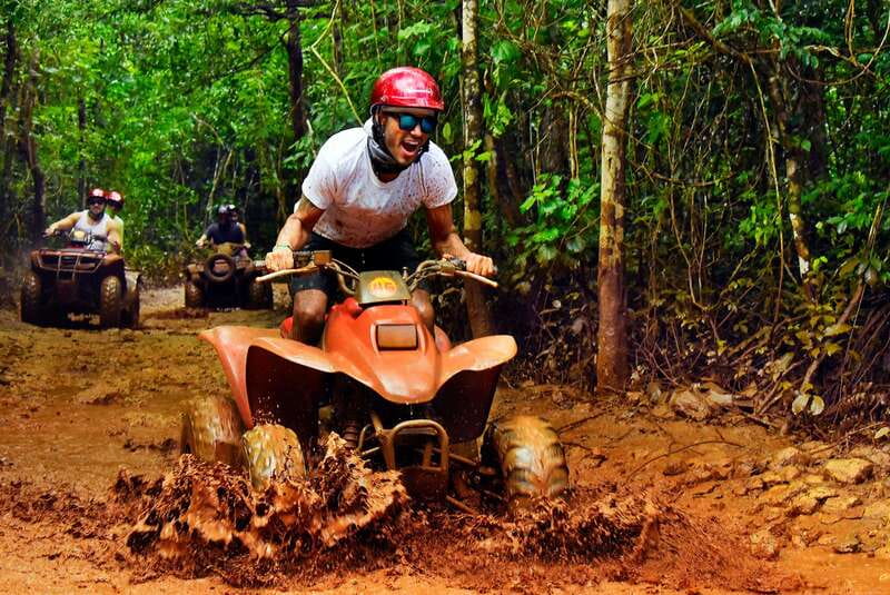 Cancun: Jungle ATV Tour, Ziplining, and Cenote Swim - Three ziplines above the jungle