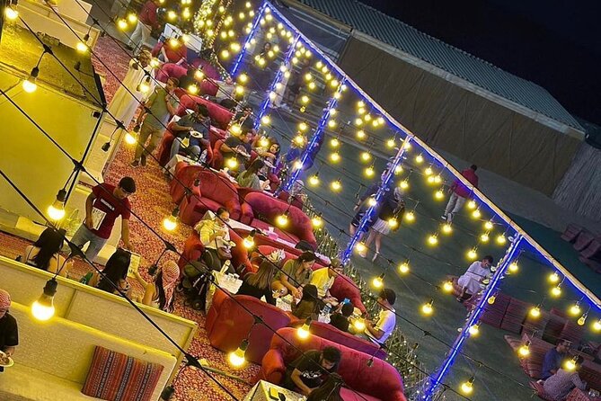 Desert Safari BBQ Dinner, Live Shows, ATV Bikes, Sandboarding - Camel ride, coffee, dates, and camp customs