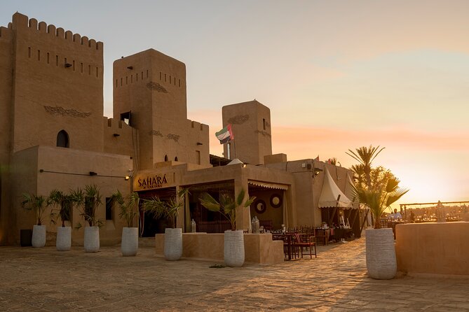 Desert Safari: Luxury Fortress Dinner, Camel Ride & Dune Bashing - Red dunes and a Toyota Land Cruiser