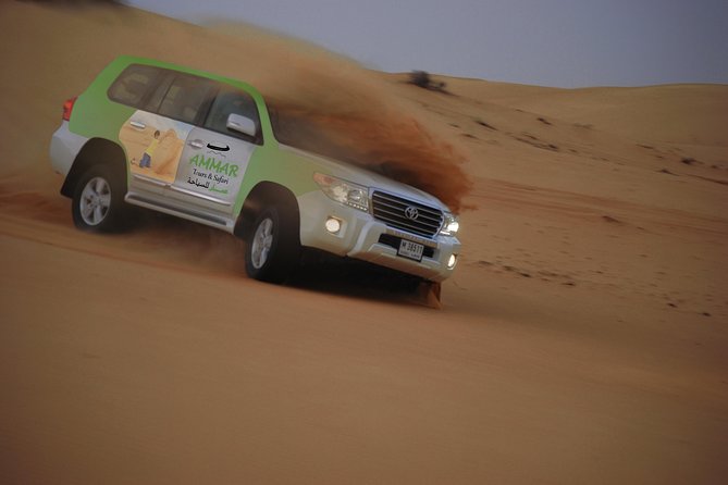 Desert Safari Tour, Quad Bike with BBQ Dinner & Show from Dubai - Sandboarding with space for repeat runs