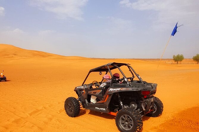 Desert Safari With BBQ Dinner, Quad Bike & Camel Ride from Dubai - Camel riding, sandboarding, falcons, and Arabic hospitality