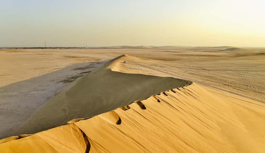 Doha: Desert Safari Dune Bashing, Sandboarding, & Camel Ride - Leaving Doha for the southern desert