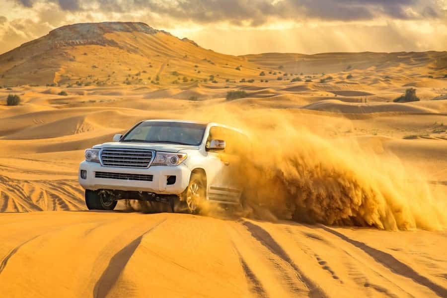 Doha: Desert Safari, Quad Biking, Sand Boarding & Camel Ride - Dune bashing in a 4WD Toyota