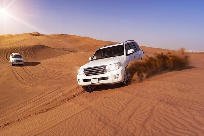 Doha: Desert Safari With Quad bike ,Camel Ride And Sand Boarding - Sandboarding on the red dunes
