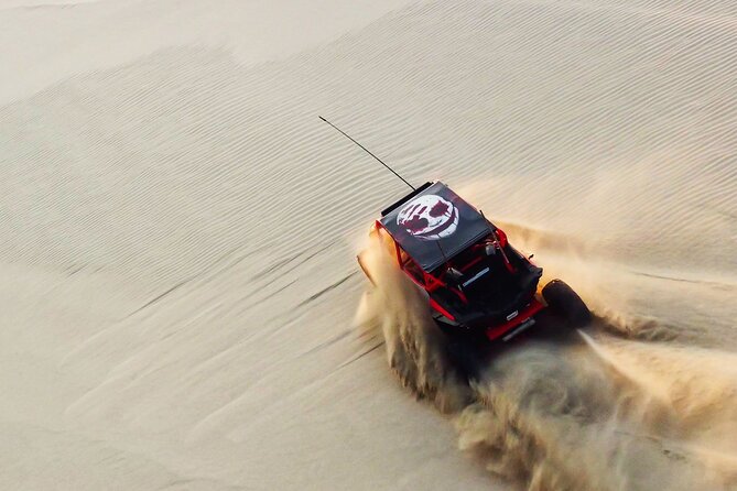 Doha-Half Day Safari with Quad Bike ATV/Camel Ride/sandboard - Sandboarding on Qatar’s dunes