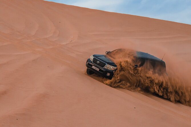 Doha Safari Adventures, Dune Bashing, Sand Buggy, Camel Ride Tour - Sandboarding on the dunes