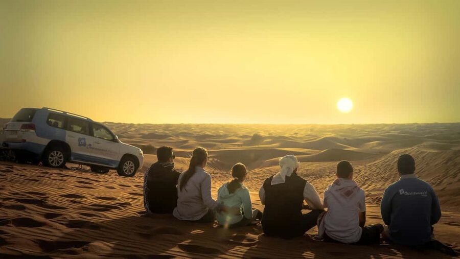 Doha: Sunset Desert Safari, ATV, Camel Ride and Sandboarding - Sandboarding down the dunes
