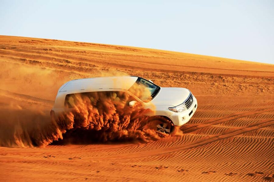 Doha: Sunset Desert Safari, ATV, Camel Ride and Sandboarding - Khor Al Adaid, where water meets the desert