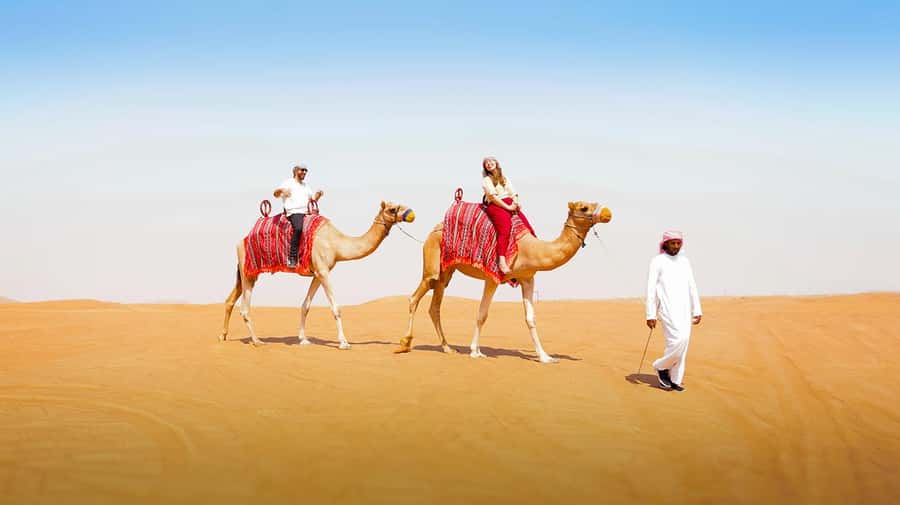 Dubai: Desert Safari, Camel Ride, Sandboarding, Quad Bike - BBQ, dancing, and the longer evening program