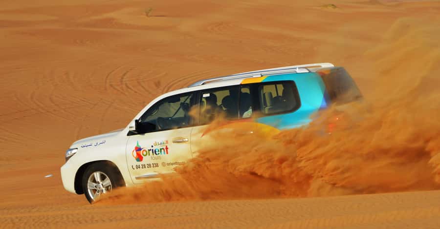 Dubai Desert Safari, Quad Biking, Camel Ride, & Sandboarding - Sunset Photos and a Five-Minute Camel Ride