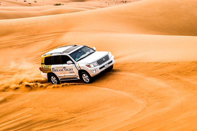 Dubai Desert Safari with Dune Bashing, Camel Ride, & BBQ Dinner - Belly dancing, tanoura, and the fire show