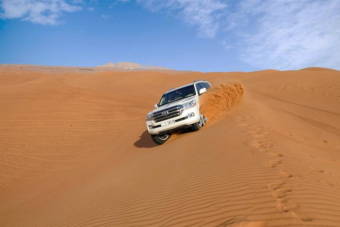 Dubai Desert Safari with Dune Bashing, Camel Rides & BBQ - Sunset from a high dune