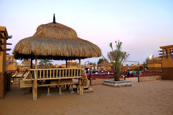 Dubai Desert Safari with Dune Bashing, Camel Rides & BBQ - Sandboarding for a quick taste of desert sport