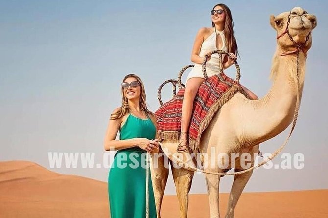 Dubai Desert Safari with Quad Bike, sandboarding, live show & BBQ - Sandboarding and the sunset photo stop