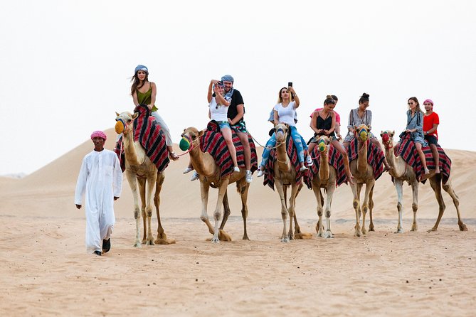 Dubai Desert Safari with Quads, BBQ Dinner, Camel ride, & Shows - Dune Bashing Before Sunset