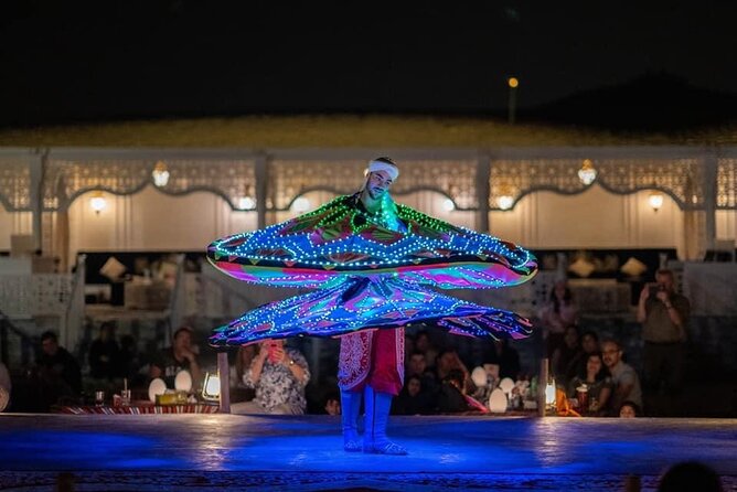 Dubai Dunes Safari With Quad Bike, Camel Ride, BBQ Dinner & Live Shows - Belly dance, tanura, and fire performances