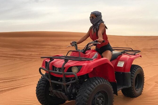 Dubai Dunes Safari With Quad Bike, Camel Ride, BBQ Dinner & Live Shows - Guides, photographs, and the human side of the trip