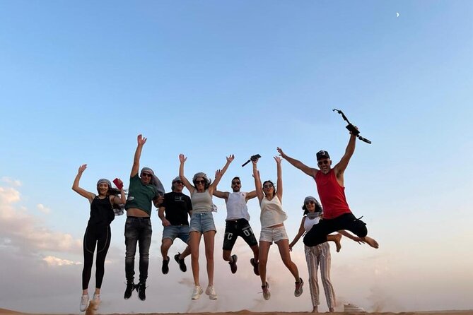 Dubai Evening Desert Safari With Transfers Dune Bashing & Dinner - Dune bashing and sunset photographs
