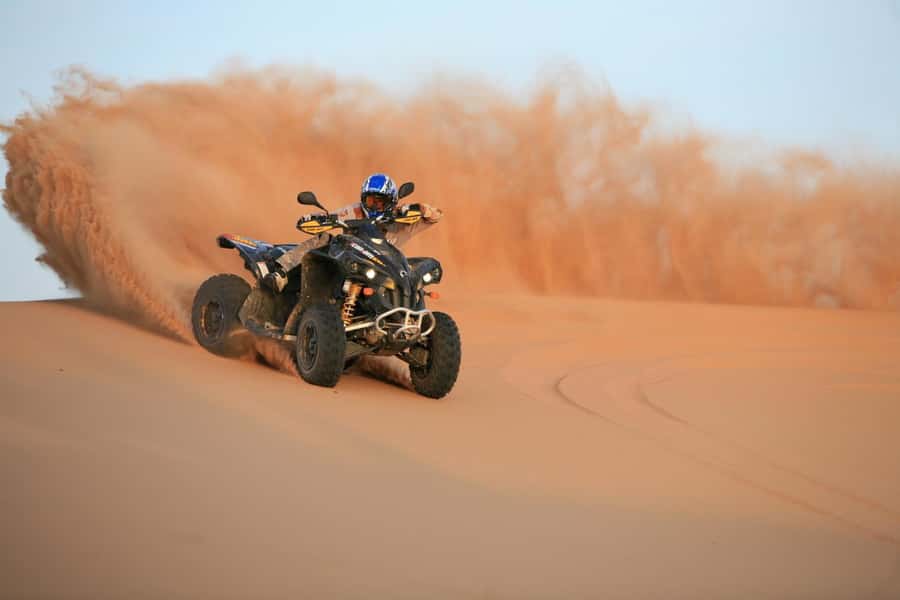Dubai: Evening Tour with Quad Biking, Camel Ride, and BBQ - Leaving Dubai for the red dunes
