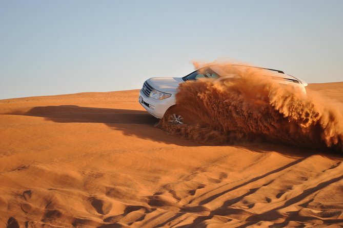 Dubai: Jeep Desert Safari, Camel Ride, and Quad Bike Tour - Jeep dune bashing and the four-in-one format