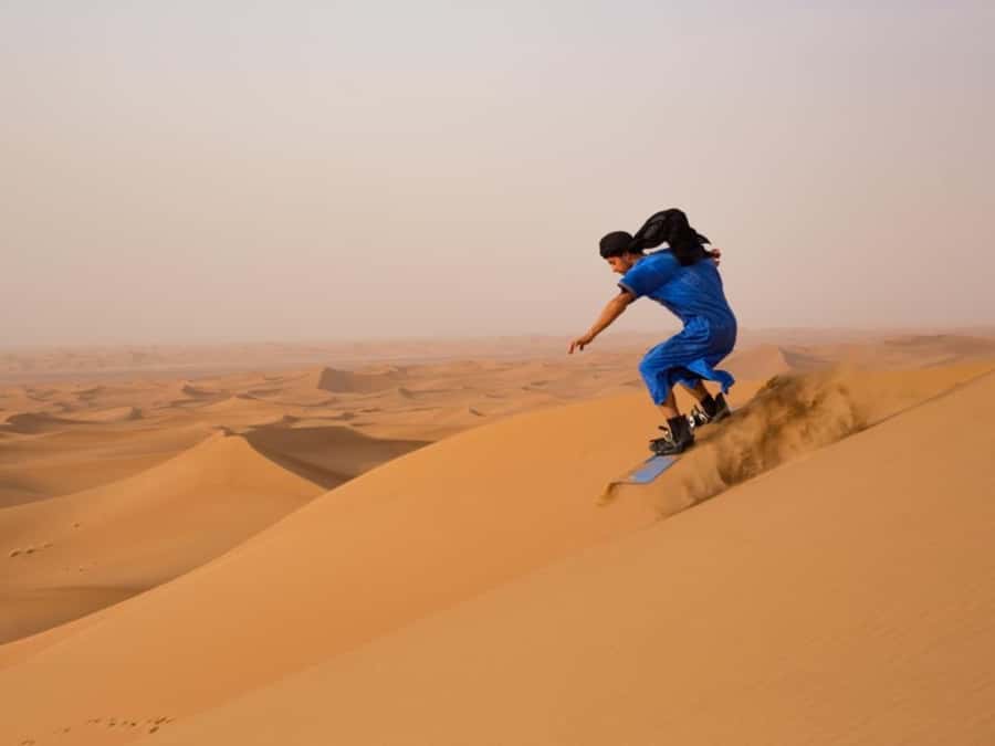 Dubai: Private Dune Buggy, Camel Ride, and Sand Boarding! - Meeting John the camel after the drive