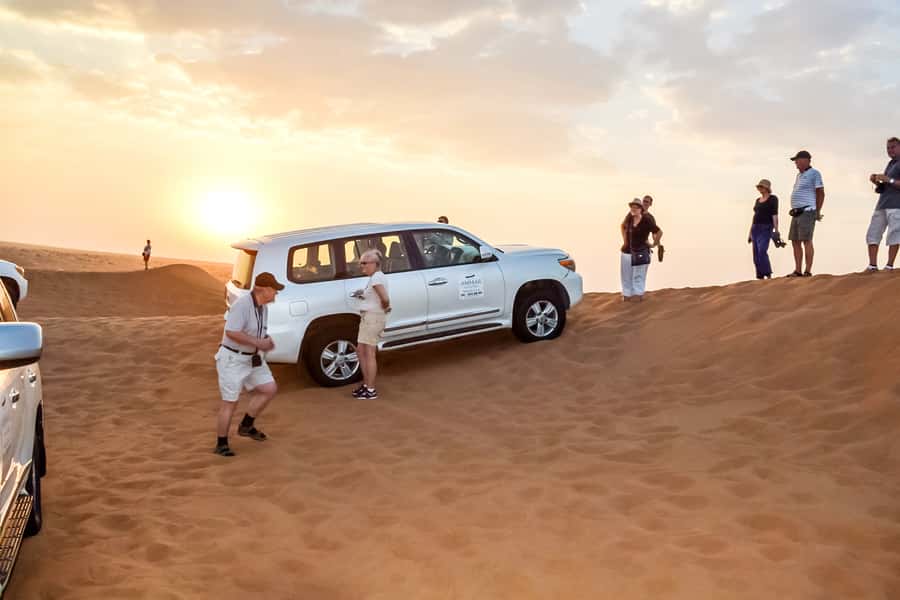 Dubai: Red Dune Safari, Quad Bike, Camel Ride, BBQ Dinner - Sandboarding and sunset photos on the highest dunes
