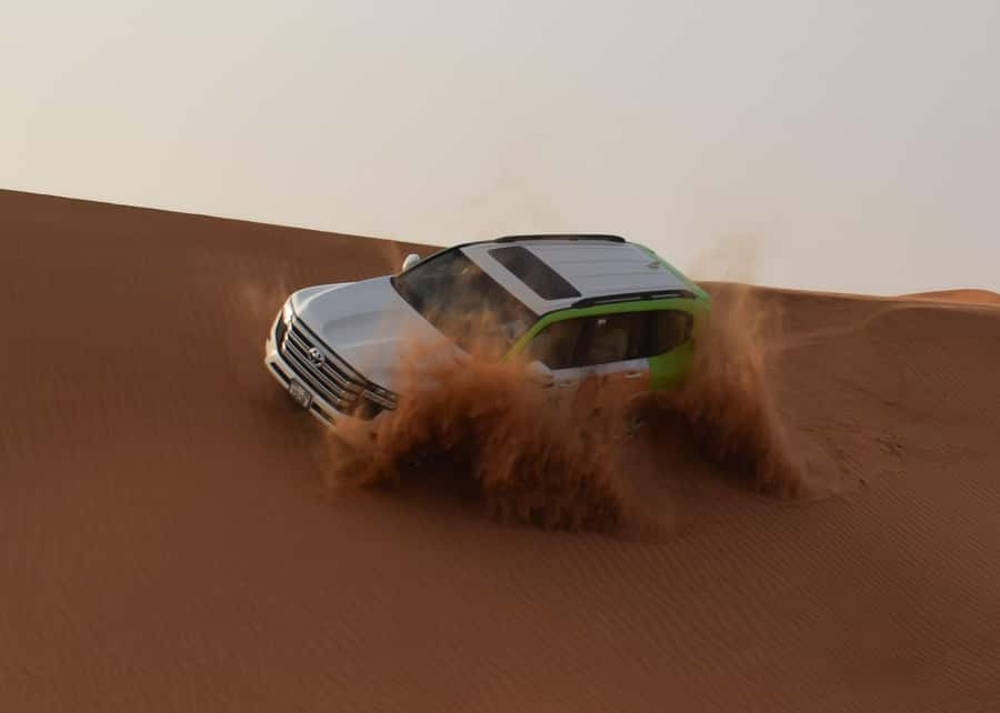 Dubai: Red Dune Safari, Quad Bike, Camel Ride, BBQ Dinner - Quad biking across a marked desert track