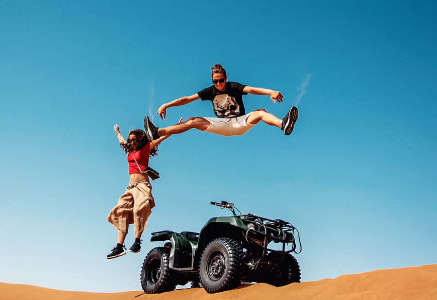 Dubai: Red Dunes Quad Bike with Sandboarding, Camels and BBQ - From Dubai to the red dunes