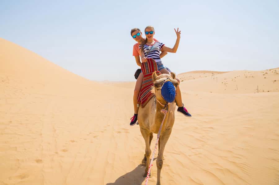 Dubai: Red Dunes Quad Bike with Sandboarding, Camels and BBQ - Sandboarding and desert photo stops