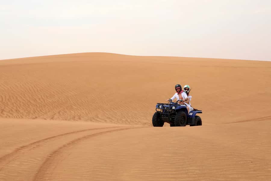 Dubai: Red Dunes Quad Bike with Sandboarding, Camels and BBQ - Timing, comfort, and seasonal heat