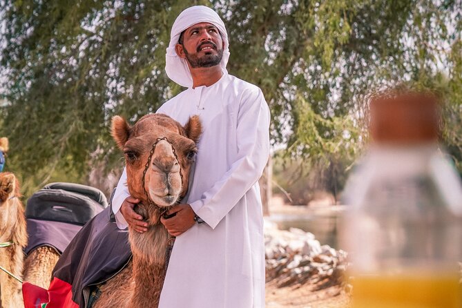 Dubai Red Dunes Safari: Dune Bashing, Camel Ride & Breakfast - Sandboarding on the red sand