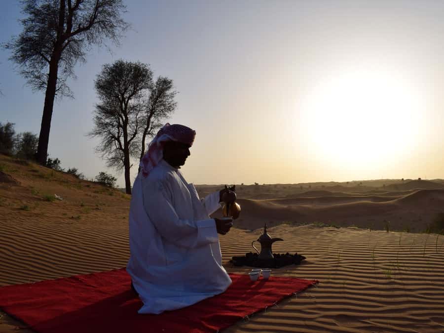 Evening Desert Dune Bashing by 4<em>4 Vehicle – The key points at a glance’ /></p>
<ul>
<li><strong>45 minutes of 4×4 dune bashing:</strong> The main thrill is a proper desert drive over steep slopes, turns, and soft sand.</li>
<li><strong>A full evening for $49:</strong> Pickup, dinner, drinks, camel riding, sandboarding, entertainment, and henna are included.</li>
<li><strong>Bedouin-style oasis camp:</strong> The evening shifts from adrenaline to a relaxed camp setting with snacks, coffee, and traditional food.</li>
<li><strong>BBQ buffet with vegetarian food:</strong> You have plenty of choice, including a vegetarian option.</li>
<li><strong>Shows after dinner:</strong> Belly dancing, fire dancing, and a traditional skirt performance keep the camp lively.</li>
<li><strong>Optional paid extras:</strong> Quad biking, falcon photos, and souvenir pictures cost extra, so bring no assumption that every desert activity is included.</li>
</ul>
<h2>From Ras Al Khaimah hotels to the open desert</h2>
<p><img width="900" height="675" decoding="async" src=