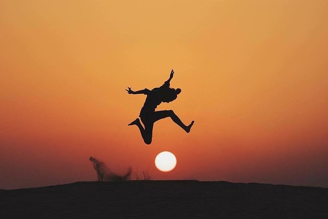 Evening Dubai Safari with BBQ, Dance Shows & Quad Biking optional - Sunset photos, camels, and the camp welcome