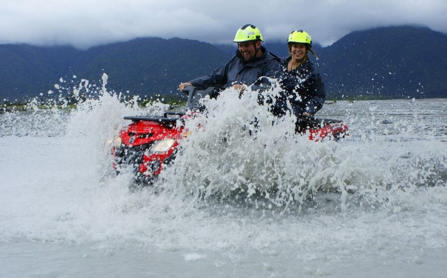 Franz Josef Town: Scenic Glacier Quad Bike Tour with Gear - Into Jurassic rainforest and moving water