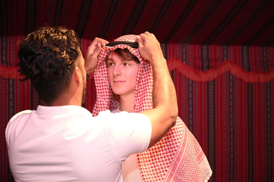 From Abu Dhabi: Dune Bashing Desert Safari - Sandboarding, costumes, and optional quad biking