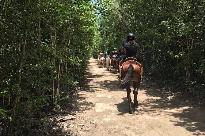 Horseback Riding plus ATV, Cenote, Ziplines, and Lunch - Cooling off at a Mayan cenote