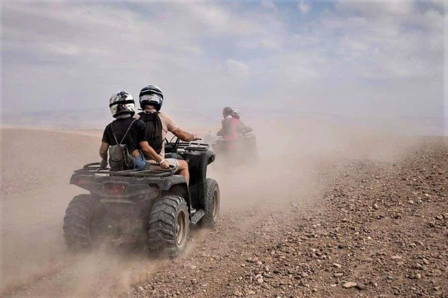 Marrakech: Agafay Desert Quad Biking with Dinner & Show - Riding across Agafay at sunset