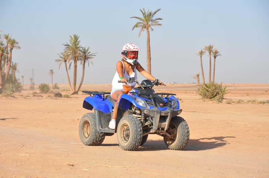 Marrakech: Desert and Palm Grove Quad Tour with Tea - Riding through the rocky desert